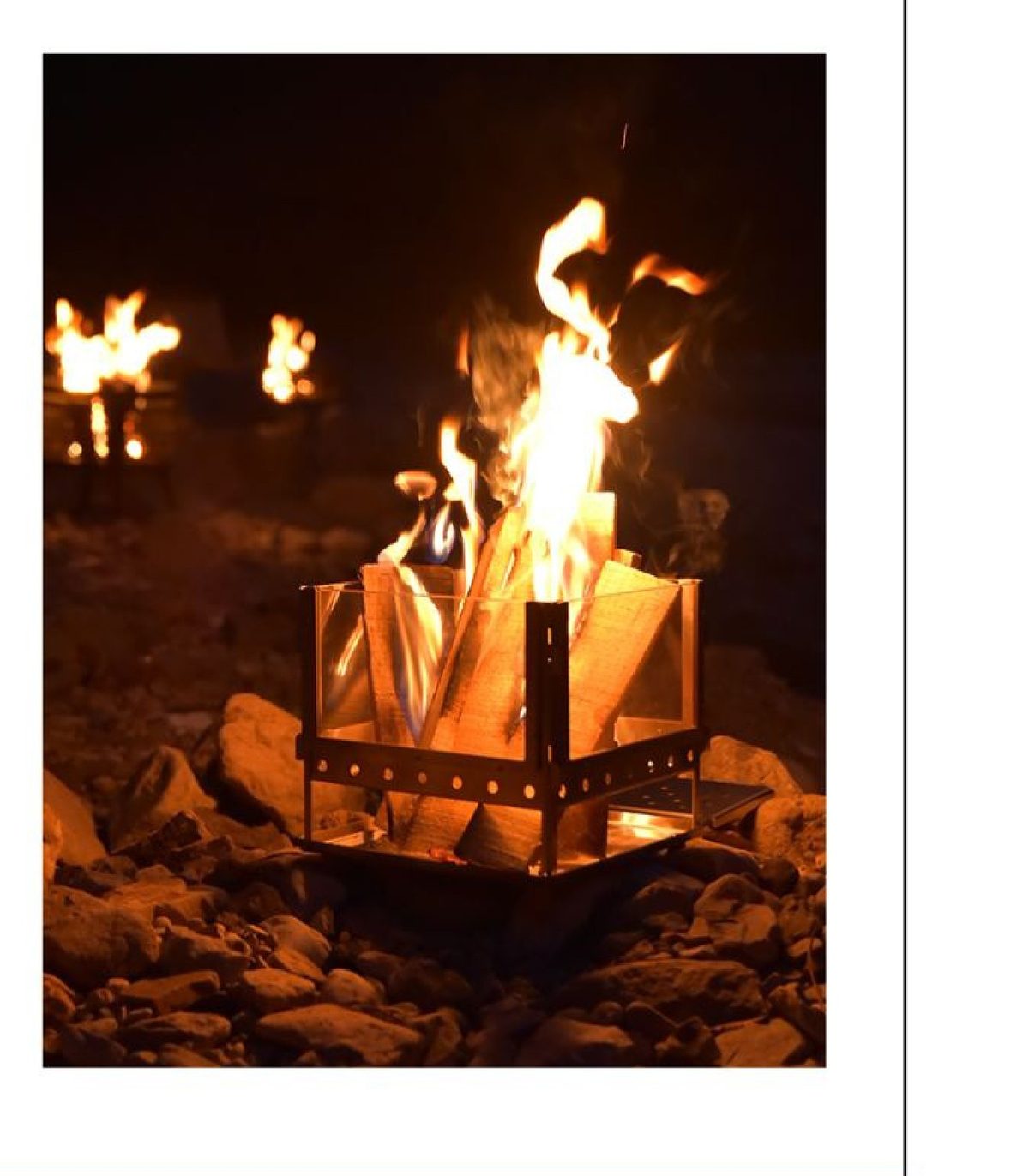Glass-door wood-burning tent stove with a live flame